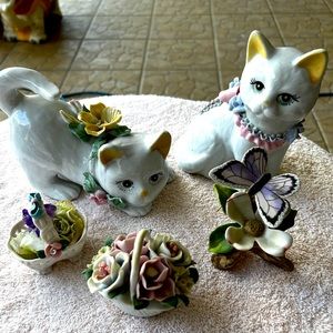 Ceramic cats with butterfly flowers